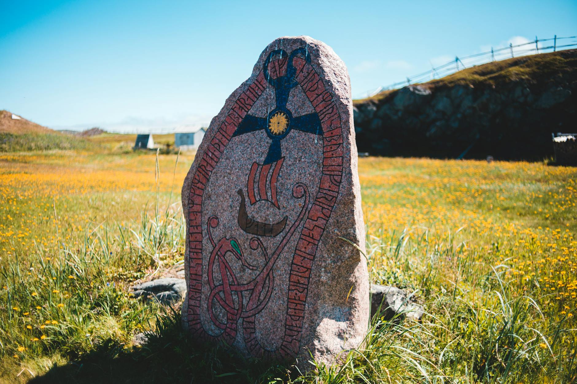A runestone in a field.