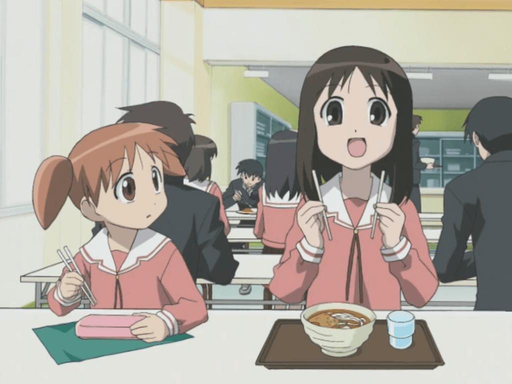 A scene from Azumanga Daioh: Chiyo looking on as Osaka celebrates perfectly separating a pair of chopsticks.