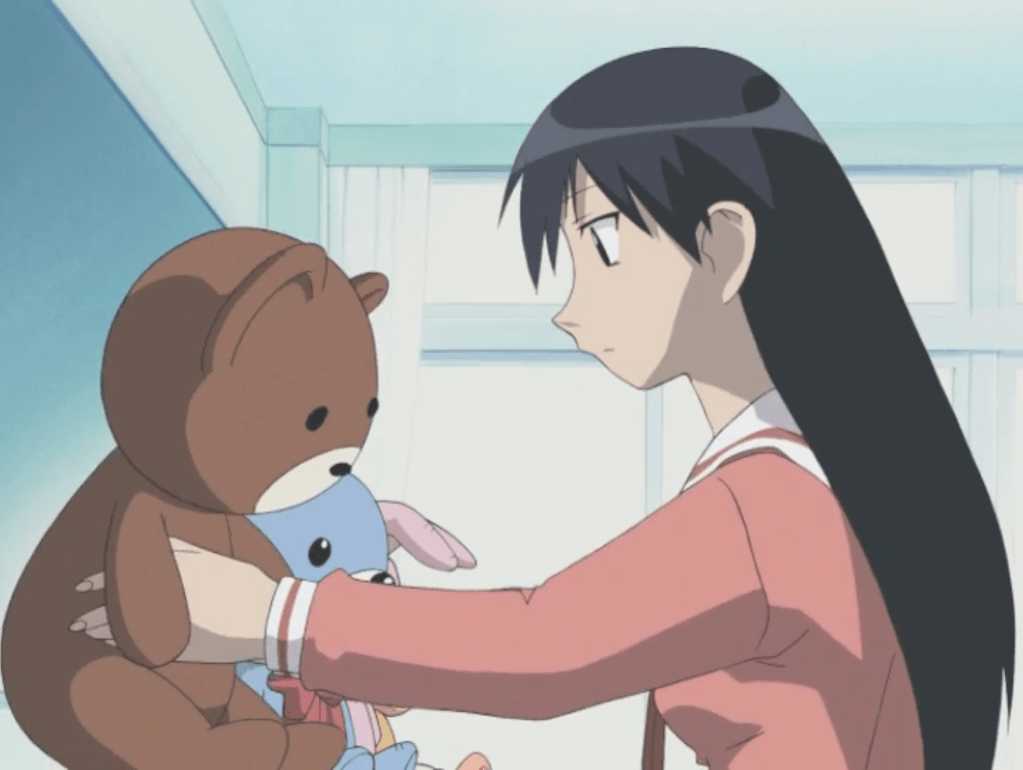 A scene from Azumanga Daioh: Sakaki preparing a display of stuffed animals.