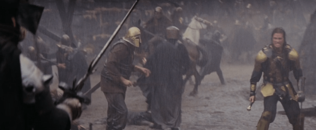 A battle scene from "Willow", featuring Val Kilmer's character in bright gold armour.