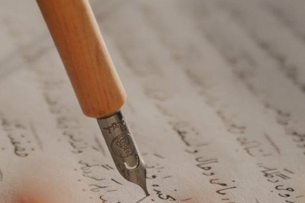 A fountain pen writing on a page.