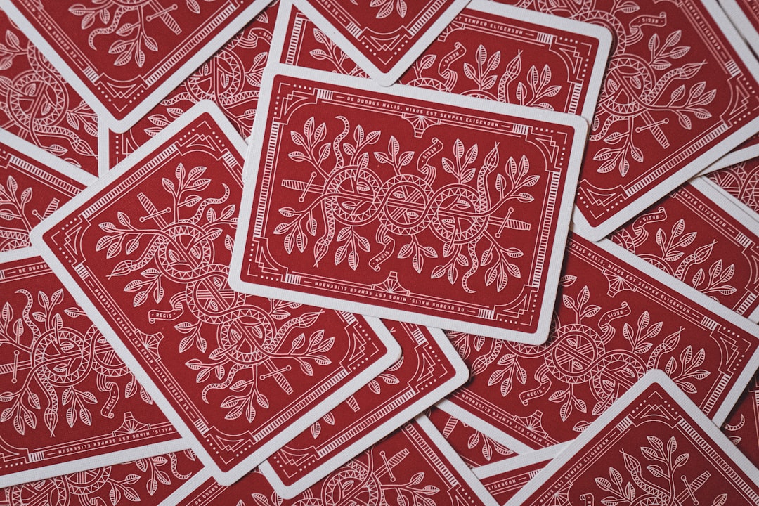 Playing cards scattered around a table.