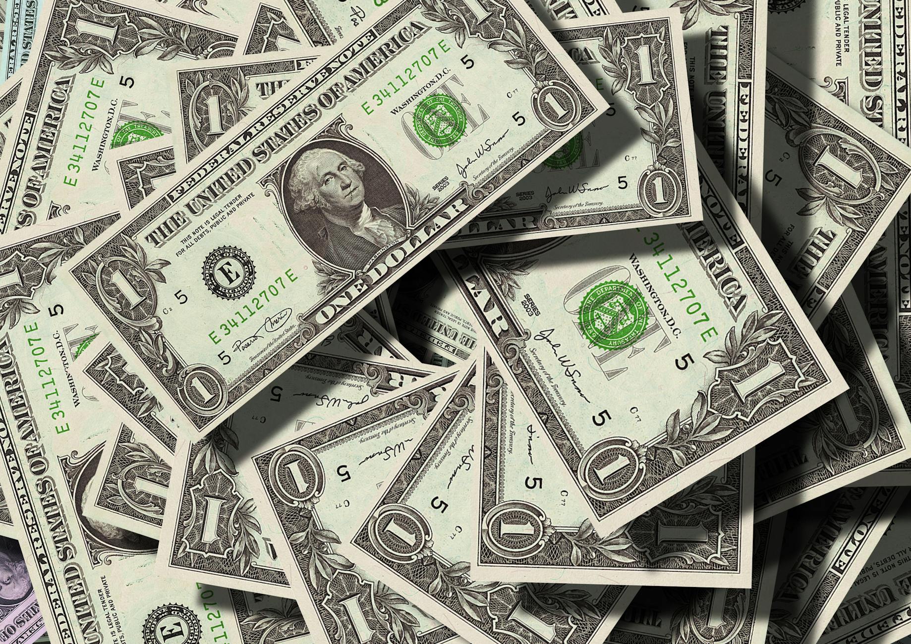 A pile of American one-dollar bills.