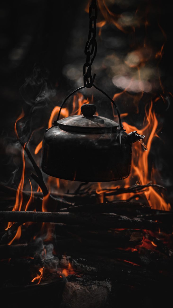 A kettle over a fire.