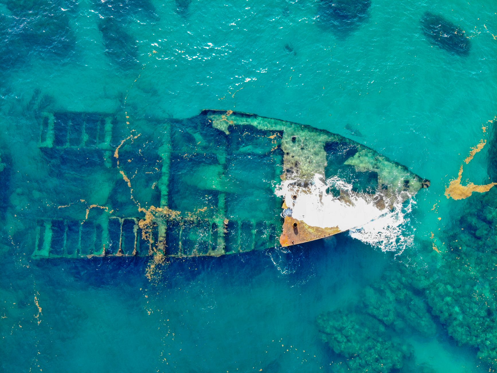 A partially submerged shipwreck.